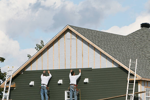 Professional Storm Damage Siding Repair technician working in Germantown, IL